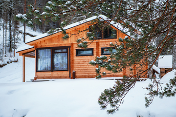 Image showing Winter holiday house in forest.