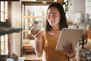 Image showing Creative asian woman, tablet and smile for pottery business, checking inventory or pricing at workshop. Happy Japanese female smiling holding touchscreen with pot art for quality check or startup