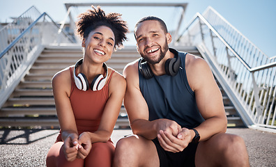 Image showing Sports, love and couple on stairs in city on break from exercise workout with smile and headphones. Motivation, health and fitness goals, man and woman rest on New York steps on morning training run.