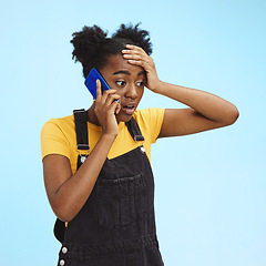 Image showing Shocked, surprised and black woman on a phone call for news isolated on a blue background in studio. Wow, crazy and African girl talking about gossip and bad communication on a mobile on a backdrop