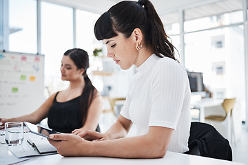 Image showing Woman, office and tablet with focus, business people and analytics for planning, data or company success. Corporate women team, mobile touchscreen tech or together for collaboration, strategy or goal