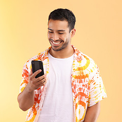 Image showing Man with smartphone in hand, smile and happy with chat or social media, communication isolated on studio background. Technology, happiness and funny meme, phone with internet wifi and mockup