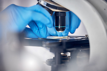 Image showing Microscope, science and scientist hands, analysis of data or DNA sample, microbiology or biotechnology research study. Particles zoom, bacteria and doctor in laboratory for scientific innovation.