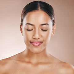 Image showing Cosmetics, beauty and face of a woman with a glow from dermatology, luxury makeup and skincare on a studio background. Zen, happy and headshot of a cosmetic model with facial cosmetology wellness