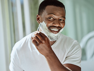 Image showing Cream, razor and shaving black man in the bathroom for skincare, beard grooming routine and facial care. Smile, treatment and African person start to shave face for hair removal with foam in morning