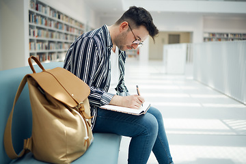 Image showing Library, student and college man writing ideas for educational task in notebook with focus. Learning, knowledge and education of smart university guy thinking of assignment with concentration.