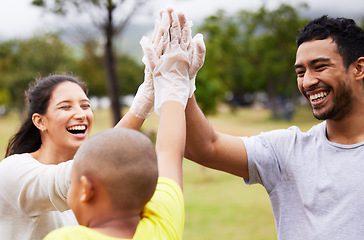 Image showing Volunteer high five, happy celebration and community cleaning garbage, pollution or waste product for environment support. Recycle, NGO charity and eco friendly people help with nature park clean up