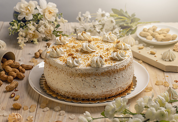 Image showing Cake with whipped cream and nuts