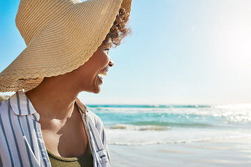 Image showing Black woman, smile and beach on summer vacation, holiday or getaway relaxing and enjoying the warm sunny day. Happy female smiling in joy for freedom sunshine, water and travel in relax by the ocean