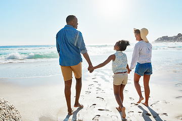 Image showing Happy family, tropical and beach walk during summer on vacation relaxing and enjoying the scenery at the ocean. Sea, water and parents with daughter, child or kid with childhood freedom