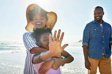 Image showing Relax, smile and fun with black family at beach for happy summer break, bonding at tropical vacation. Travel and happiness with parents and daughter playing by the ocean for freedom, sea and care