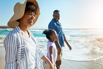 Image showing Happy family, summer and beach walk by parents and child on vacation or holiday at the ocean or sea. Travel, mother and father with African daughter or kid holding hands together near water