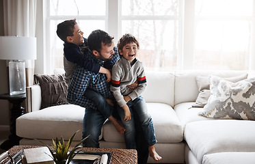 Image showing Happiness, playful and father with children on the sofa for playing, quality time and crazy fun. Love, happy and boy kids piling onto their dad with energy on the couch of their family home together