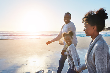 Image showing Black family, sunset and walking on a beach by parents and child on vacation or holiday at the ocean or sea. Mockup, mother and father travel with daughter or kid holding hands together near water