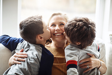 Image showing Kiss, bonding and a mother with children for love, relax and playing in a family home together. Hug, smile and mom with affection for boy kids during quality time on the living room sofa of a house