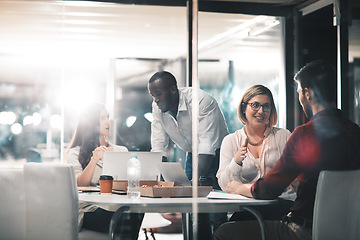 Image showing Business, late night help and team at workshop with ideas, laptop and food planning startup project job. Teamwork, overtime and conversation, men and women brainstorming at creative marketing agency.