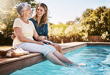 Image showing Family, women by pool and relax together with love and care, quality time in summer vacation. Elderly mother, daughter and vacation, outdoor swimming pool and wellness lifestyle with happy family