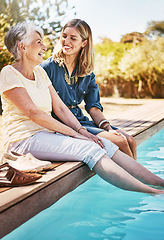 Image showing Women relax together, happy and swimming pool, love with care and quality time during summer vacation. Elderly mother, daughter and vacation, outdoor pool and wellness lifestyle with happy family