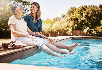 Image showing Women relax together by swimming pool, love and care, quality time during summer vacation. Elderly mother, daughter and vacation, content outdoor with pool and wellness lifestyle with happy family