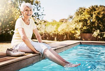 Image showing Pool, portrait and senior woman by the water while on a vacation, adventure or outdoor trip in summer. Happy, smile and elderly lady in retirement with her feet in the swimming pool at holiday resort