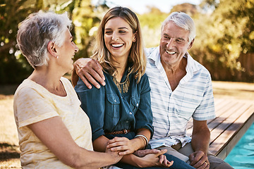 Image showing Family, senior parents and woman by pool holding with care, love and hug bonding outdoor. Smile, happy person and people in retirement with adult daughter together with bokeh in nature in summer