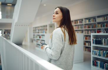 Image showing Library, thinking student and woman with phone in university, college or school. Ideas, scholarship and female with mobile smartphone for knowledge, researching or studying, learning and education.