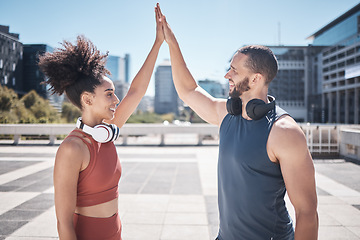 Image showing Fitness high five, success and couple in the city, cardio training and motivation for workout. Support, achievement and runner man and woman excited about exercise, goal and target in France