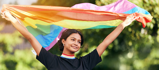 Image showing Rainbow, flag and gay pride with an indian woman in celebration of lgbt human rights alone outdoor. Freedom, equality and lgbtq with a happy female outside celebrating her equality or inclusion