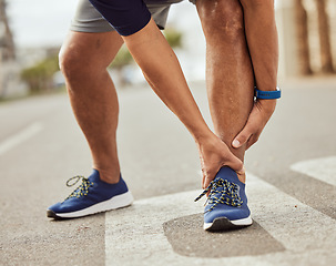 Image showing Fitness, pain in ankle and hands of black man with muscle ache, joint pain and injury after running in city. Sports, body wellness and male athlete rest after workout, marathon training and exercise