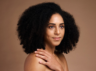 Image showing Black woman, studio and thinking with beauty, makeup and cosmetic wellness with hands, skincare or afro hair. Model, soft skin glow and facial cosmetics, self care or ideas by brown studio background