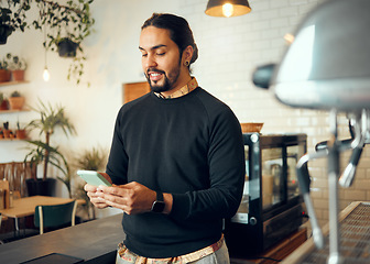 Image showing Startup cafe manager or man with phone for social media, networking or company blog content review. Happy, smile or coffee shop employee with smartphone for social network, research or mobile app