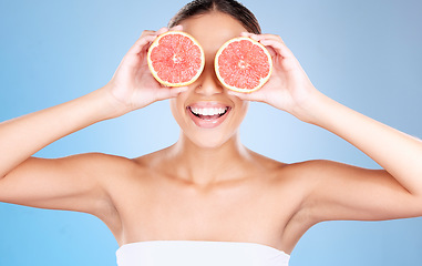 Image showing Grapefruit, skincare and wellness of a woman with fruit, cosmetics smile or healthcare face glow. Model, happy or girl with fruits for health, cosmetic and healthy aesthetic facial beauty with food