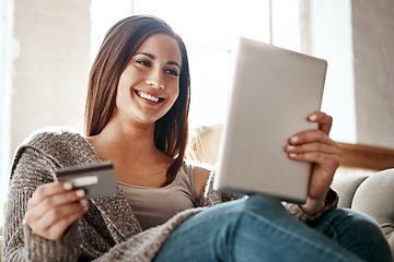 Image showing Woman, online shopping and digital tablet with credit card on sofa for payment on ecommerce sale. Girl, debit card and booking online, credit score and easy purchase of convenience in a living room