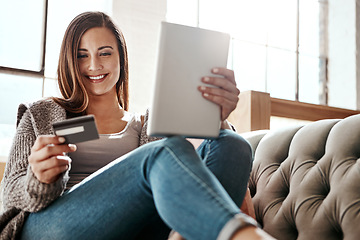 Image showing Payment, digital tablet and credit card by woman on a sofa, ecommerce and online shopping in her home. Girl, online shopping and relax checking debit card for purchase or subscription in living room