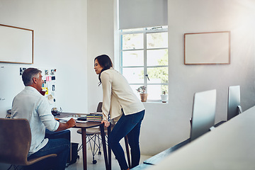 Image showing Office, teamwork and business people by desk talking in modern workplace. Planning, collaboration and female employee discussing sales, advertising or marketing strategy with senior boss in company.