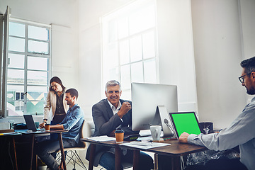 Image showing Portrait, teamwork and business man by computer in office workplace. Laptop, mockup green screen and elderly male employee working on marketing, advertising or sales project with people or coworkers.