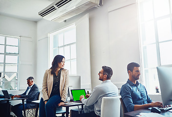 Image showing Laptop green screen, teamwork and business people in office talking, discussion or conversation. Collaboration, mock up and employees, man and woman planning marketing, advertising or sales project.