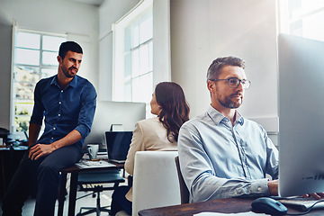 Image showing Teamwork, office and business people at desk working on planning, marketing strategy and writing email. Corporate agency, startup and staff focus sitting at table, in meeting and coworking on ideas