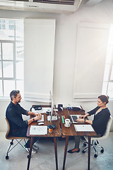 Image showing Laptop, computer and business people with opposite desk in office workplace. Planning, strategy and workers, man and woman with computers typing or working on sales, marketing or advertising project.