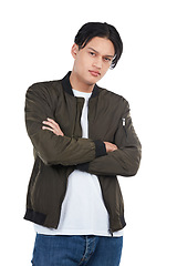 Image showing Confident, trendy and portrait of an Asian man with arms crossed isolated on a white background. Fashion, cool and edgy model posing with confidence, tough style and serious on a studio backdrop