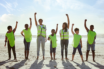 Image showing Children, volunteer and beach clean up with friends standing on the sand together for eco friendly conservation. Team, nature and cleaning with kids cleaning the environment for a green earth