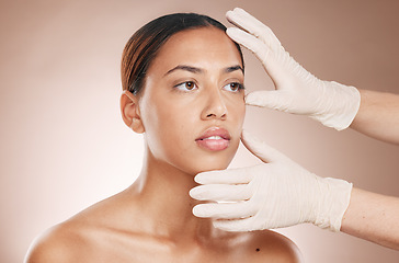 Image showing Rhinoplasty, hands and woman consulting for face botox, beauty implant or makeup cosmetics. Facial consultation, skincare and plastic surgery for aesthetic change from body laser on studio background