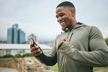 Image showing Fitness, winner or black man on phone with success or winning a training, exercise or workout competition online. City, excited or healthy sports athlete happy with sponsorship deal, goals or mission