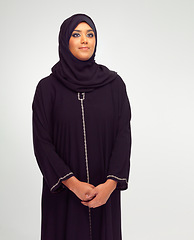 Image showing Beauty, muslim and young woman in studio with a traditional, religious and modern dress. Religion, hijab and islam female model in an islamic culture outfit and headscarf isolated by white background