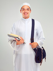 Image showing Muslim man, islamic student and standing ready for religious studying, worship or spiritual education in white background. Arabic person, happy and books or culture lifestyle isolated in studio