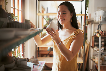 Image showing Art, store and creative business woman with pottery, product and startup vision in her studio, happy and smile. Ceramic, sculpture and asian woman excited about dream job and small business in Japan