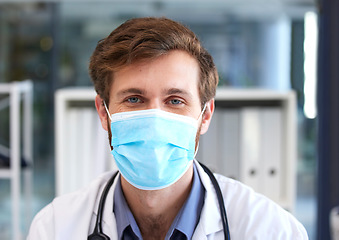 Image showing Portrait, man and doctor with covid face mask in hospital for medical safety, healthcare risk and clinic analysis in Australia. Face, male surgeon and corona virus expert, ppe compliance and medicine