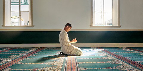 Image showing Muslim pray, hope or hands in prayer on carpet for peace, gratitude or support to Allah in holy temple or mosque. Trust, Islamic or spiritual person praying to worship God on Ramadan Kareem in Qatar