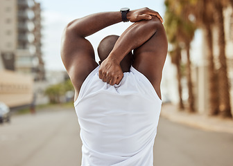 Image showing Back, black man and stretching in city, exercise and workout for wellness, health and cardio. African American male, healthy athlete and arms stretch for training, marathon and fitness for body care