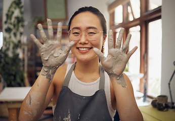 Image showing Pottery, happy and hands of a portrait woman at a messy workshop for art, design and work. Small business, dirty and creative artist with clay at a studio for creativity and artistic entrepreneurship